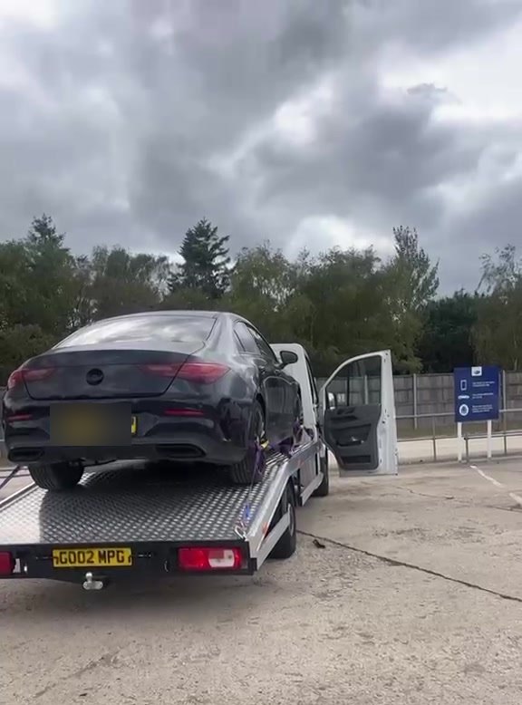 A car collected from a Copart auction site on the MPG Recovery transporter